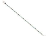 a bracelet with emerald stones on a white background