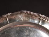 a silver plate that is sitting on a table
