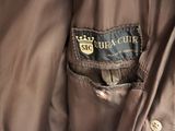 brown jacket with a black label on the back of it