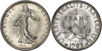 a silver coin with the image of a woman holding a tennis racquet