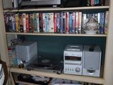 a book shelf with many books on it in a room