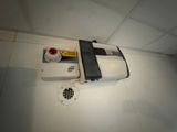 a white box with a red light and a black box with a yellow light