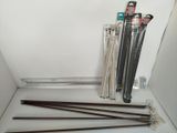 a lot of sticks that are sitting on a shelf