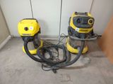 two vacuums that are sitting on the floor next to each other