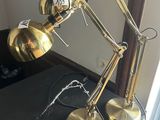 two lamps that are sitting on a black table
