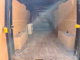the back of a van with the door open and the back of the van with the door open
