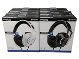 two boxes of headphones sitting on top of each other on a white surface