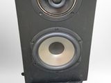 a close up of a pair of speakers on a white surface
