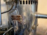 a close up of a coffee grinder on a kitchen counter