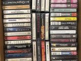 a lot of dvds in a box on the floor