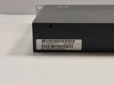 the back of a black electronic device with a bar code on it