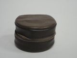 a small brown box with a zipper on it