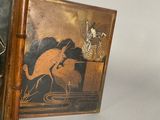 a picture of a wooden frame with a painting on it