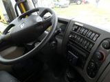 dashboard of a bus with a steering wheel and dashboard controls