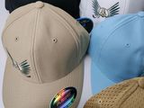 many hats that are sitting together on a table