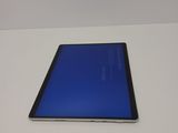an image of a tablet computer sitting on top of a white table