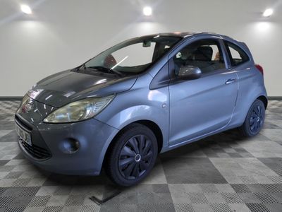 a picture of a small car parked in a garage