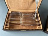 a lot of forks in a box on the table