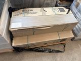 a stack of boxes sitting on top of a pallet in a warehouse