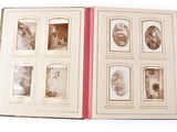 an open book with a bunch of old photos in it