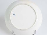 a white plate with a blue design on it