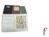 several books are stacked on top of each other on a white surface