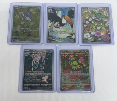 four different types of pokemon cards on a white surface