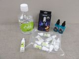 a bottle of water, a bottle of toothpaste, a bottle of mouthpaste, and two bottles of mouthpaste