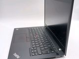 a laptop with a black keyboard on a white surface