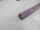 a purple bat sitting on a table next to a keyboard