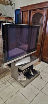 a flat screen tv sitting on a stand in a living room