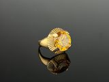 an image of a gold ring with a citrine stone in the center
