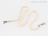 pearl necklace with silver clasp and clasp on a white background