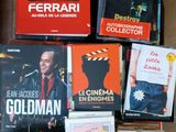 a lot of books that are sitting on a table