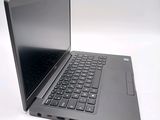 a laptop with a black keyboard on a white surface