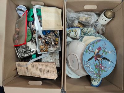 two boxes that have a lot of items in them