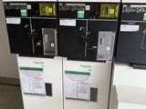 three machines are sitting next to each other in a room