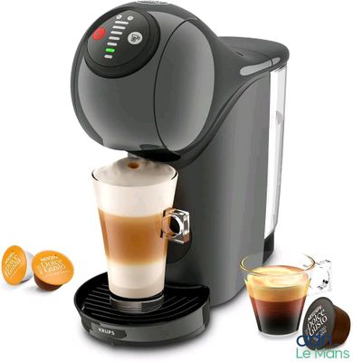 une image d'une machine à café avec une tasse de café à côté d'elle