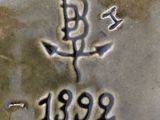 a close up of a silver plate with a design on it
