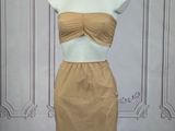 the mannequin dress is made of a tan colored material