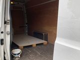 a small bed in the back of a van