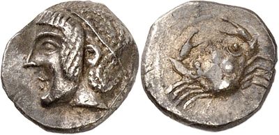 a silver coin with a woman ' s face on it