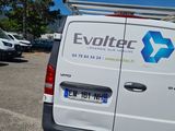 a white van that is parked in a parking lot
