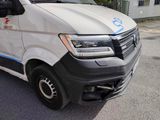 a white van that is parked on the side of the road