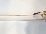 a pair of swords that are on a white surface