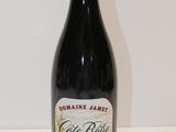 a bottle of wine that is sitting on a table