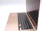two laptops that are sitting side by side on a white surface