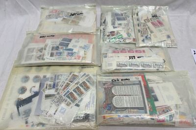 a lot of stamps and envelopes that are on a table