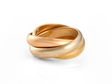 an image of a close up of a gold ring on a white surface