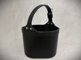 black leather bucket with a handle on a white background